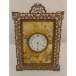 A late 19th century rectangular easel clock with pierced brass frame, the mount painted with