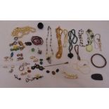 A quantity of costume jewellery to include necklaces, rings, earrings and pendants