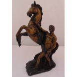 A bronze figural group of a Marly horse and tamer on naturalistic base, 29cm (h)