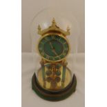 Kundo torsion pendulum clock supported by columns with Roman numerals, detachable glass dome on