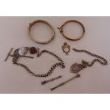A quantity of silver jewellery to include an Albert chain, bangles, pendants and propelling