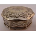 An Indian white metal hexagonal hinged box engraved with flowers and leaves, the inside engraved