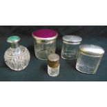 Five dressing table bottles with silver covers, tallest 11.5cm (h)