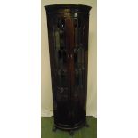 A mahogany glazed corner cabinet, demilune on four supports, 186 x 59.5cm