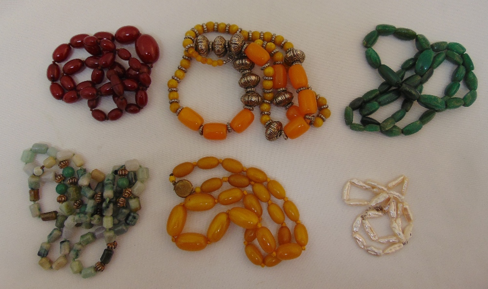 Six bead necklaces to include an amber necklace