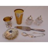 A quantity of silver to include a horn beaker with silver mounts, a cup, a tea strainer on stand,