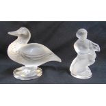 A Lalique figurine of a duck in original packaging and a Lalique figurine of a woman with a
