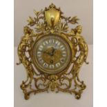 Art Nouveau brass easel clock, scroll pierced flanked with female figures, white enamel dial with