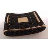 A 19th century shaped rectangular quilted tortoiseshell and gold snuff box, the hinged cover with