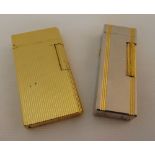 Caran D'Ache gold plated cigarette lighter and a Dunhill cigarette lighter