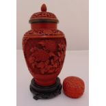 A cinnabar lacquer vase and cover and a cinnabar lacquer circular covered box