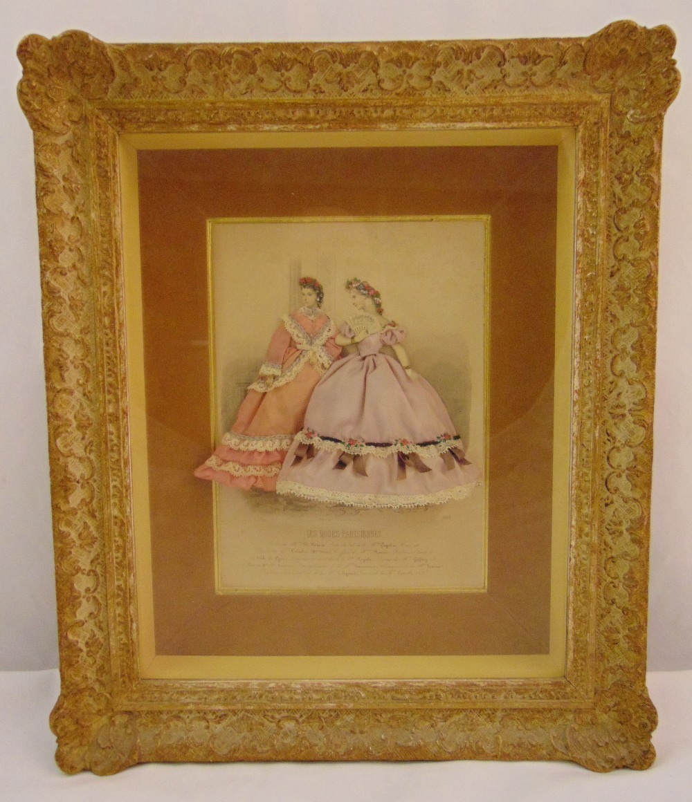 A framed and glazed French fashion display of two ladies in silk dresses, 45 x 38.5cm