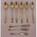 A quantity of silver flatware to include six grapefruit spoons and three butter knives, approx total