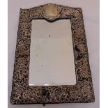 A Victorian rectangular pierced silver mounted dressing table mirror, surmounted by vacant