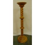 A yew wood torchere, the barley twist column on raised circular base, 97.5cm (h)