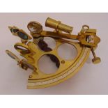 A brass naval sextant of customary form with turned wooden handle, 23 x 17cm