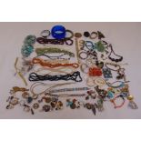 A quantity of costume jewellery to include brooches, rings, bracelets, bangles, earrings, coral