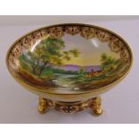 Noritake comport decorated with a landscape and gilded border on removable raised circular base with