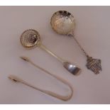 A silver sifter spoon, a Dutch white metal spoon with cast finial and a pair of hallmarked silver