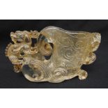 A Chinese carved rock crystal libation cup in the form of a mythological beast, 9.5 x 15.5 x 5.5cm