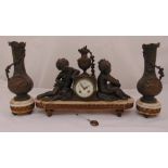 French bronzed mantle clock flanked by two putti and two vase form garnitures, clock 58cm (w)