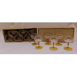 A set of twelve champagne glasses in original packaging