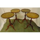 A set of four mahogany wine tables with Chippendale borders on three outswept legs, 57 x 37.5cm