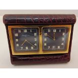 Asprey and Garrard rectangular travel clock with two dials in red leather case, 7.5 x 6cm