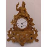 A French gilded metal late 19th century mantle clock with white enamel dial and Roman numerals