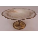 A hallmarked silver fruit stand with scallop border on raised circular base, Sheffield 1945,