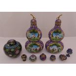 A quantity of cloisonn‚ to include gourd shape vases, a ginger jar and covered boxes, tallest