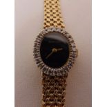 Bueche Girod 9ct gold ladies wristwatch with diamond bezel and integral 9ct gold bracelet, approx