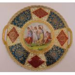 A Vienna hand painted charger decorated with dancing maidens tiwithin a border of gilded geometric
