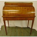 A continental roll top Kingswood and mahogany desk, the cover revealing leather mounted interior