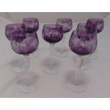 A set of eight amethyst coloured hock glasses on circular bases, 20cm (h)