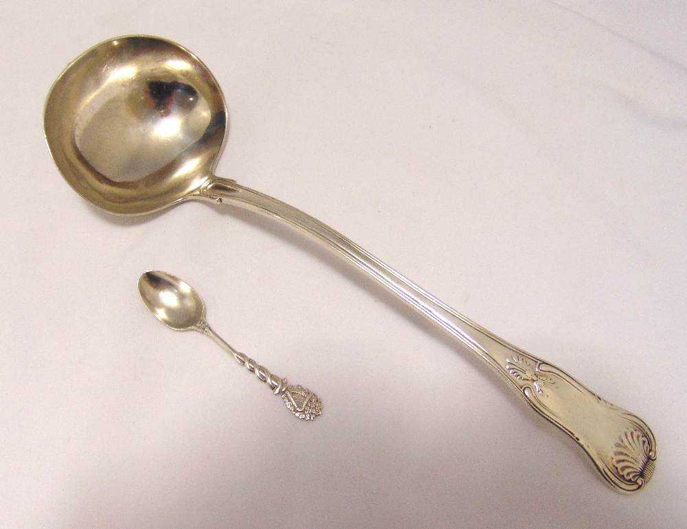 A hallmarked silver fiddle and shell soup ladle, London 1824 and a silver coffee spoon, approx total