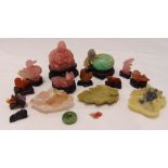 A quantity of Oriental rose quartz and stone carvings to include a Buddha, various animals and