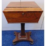 An early Victorian mahogany rectangular teapoy, the hinged cover revealing fitted interior with four