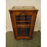 A late Victorian mahogany rectangular music cabinet with hinged glazed door and galleried top, 101 x