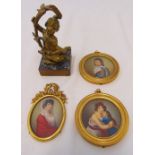 A 19th century gilt bronze putti on marble base and three framed miniature portraits, putti 16cm (