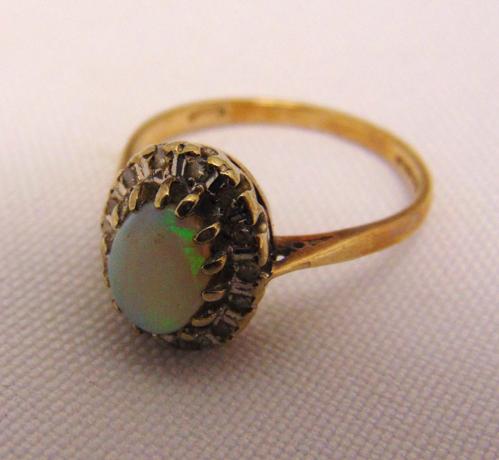 9ct gold ring set with an opal and diamonds, approx 2.8g