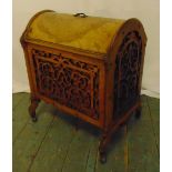 A continental mahogany chest rectangular with arched top, the pierced and scroll carved sides on