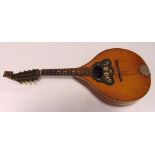 A balloon back eight string mandolin decorated with mother of pearl flowers and leaves, A/F, 64 x 27