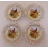 Four Staffordshire porcelain wall plates, the centres decorated with game birds, one A/F, 20.5cm (