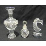 Two Lalique perfume bottles with drop stoppers and a figurine of a fish on raised circular base,