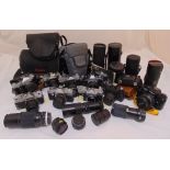 A quantity of photographic equipment to include 35mm cameras and lenses some in fitted cases