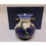 Moorcroft vase decorated with royal blue flowers and leaves, marks to the base, in original