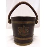 A 19th century copper bound Naval oak fire bucket with original rope and leather handle and Royal