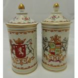 A pair of Limoges cylindrical armorial covered vases with domed pull off covers, 20cm (h)