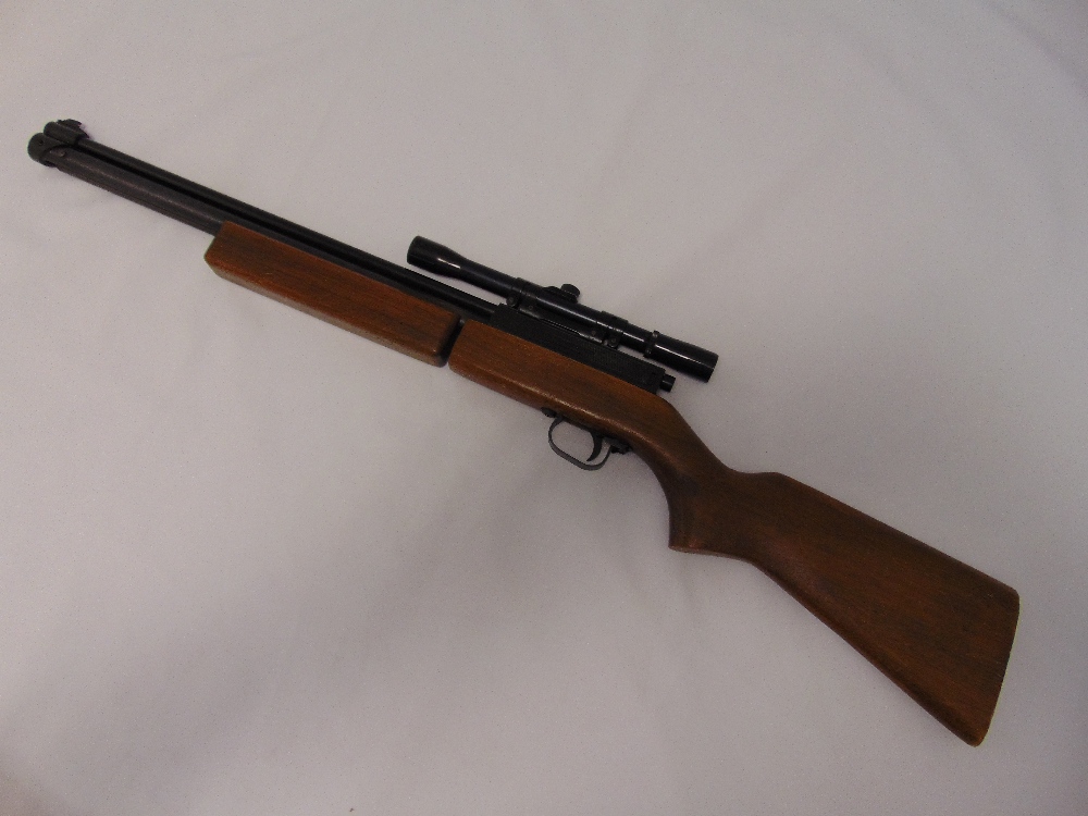 Sharp-Innova air rifle with wooden stock and metal telescopic sites